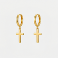 Boucles d'oreilles croix pendantes, dorées, sur fond blanc