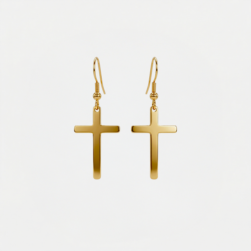 Boucles d'oreilles en forme de croix, dorées, sur fond blanc