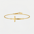 Bracelet croix chrétienne, doré, sur fond blanc