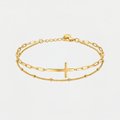 Bracelet croix de Jésus, doré, sur fond blanc