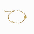 Bracelet dizainier, doré, sur fond blanc