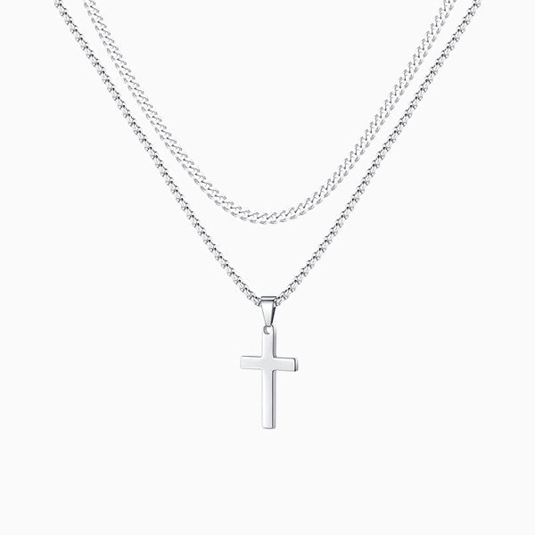 Collier croix double, porté au cou