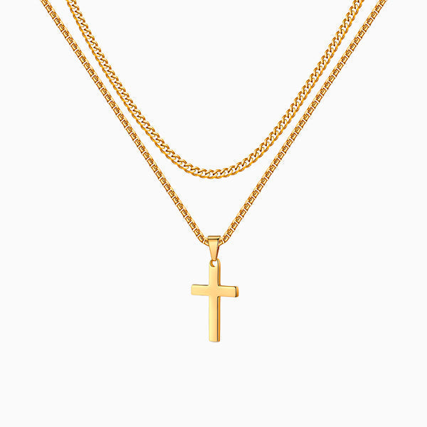 Collier croix double, doré, sur fond blanc